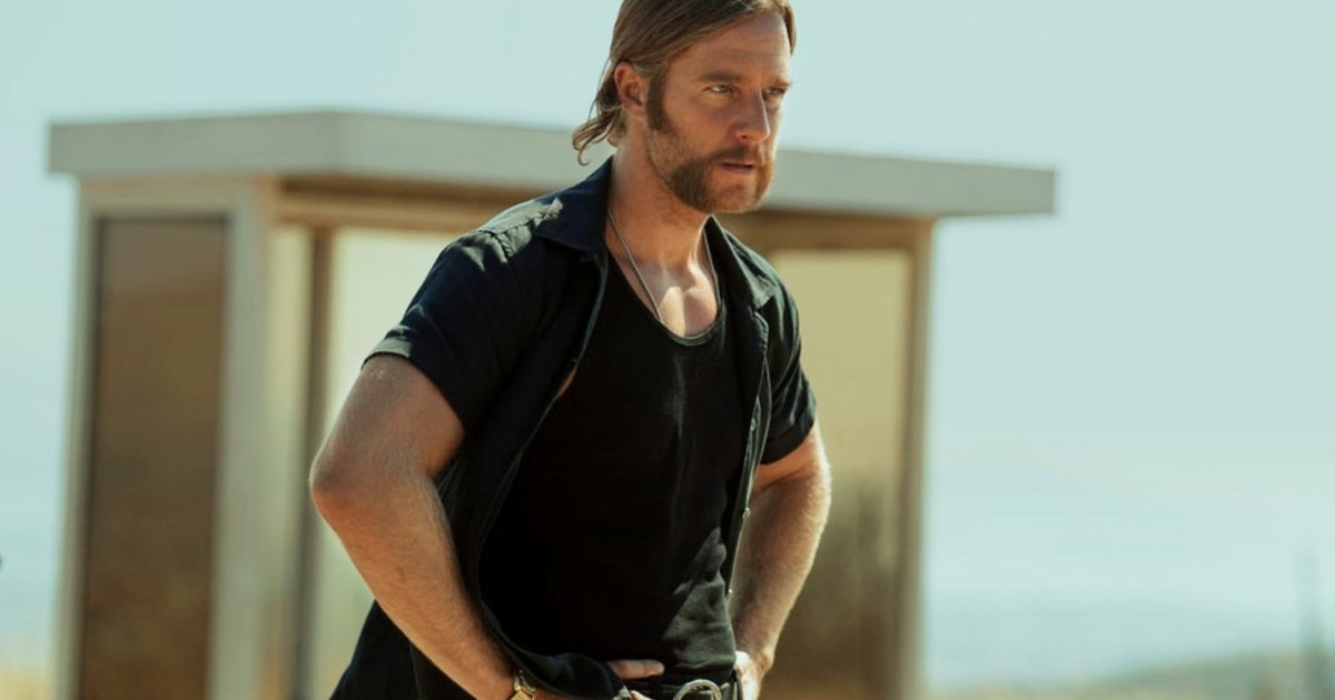 A man stares ahead in Mrs. Davis.