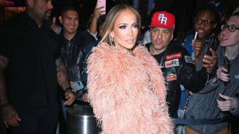 Jennifer Lopez Wore a Peach $835 “The New Arrival” Dress with a Feather Bolero and FEMME LA Heels to the Ring Them Bells benefit Concert in New York