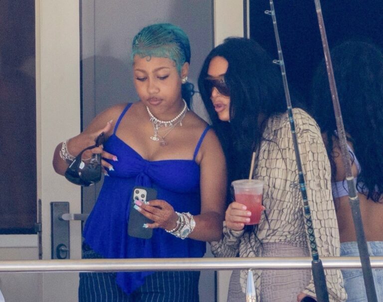 Kim Kardashian Makes Waves in Acne Snake Print Top and Skims Crocodile Bikini Top and Capris During Luxurious Yacht Getaway with North West