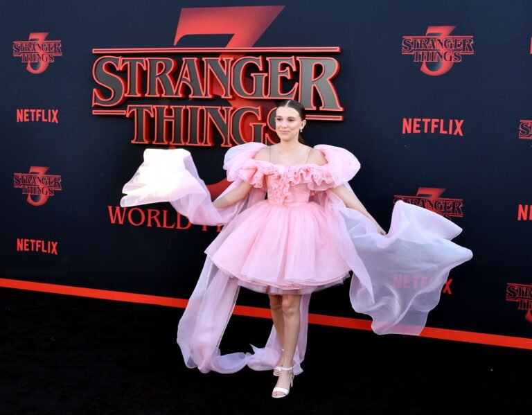 Millie Bobby Brown Embraces the “Lorde summer” Aesthetic in Chic Scarf and Cute Dress
