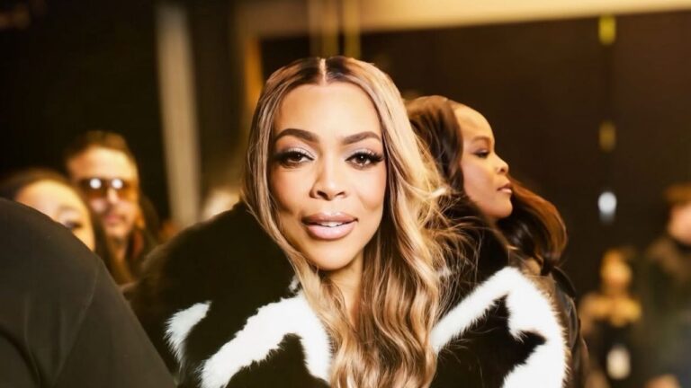 Wendy Williams Spotted at LaQuan Smith NYFW Show win a Black and White Fur Coat with Black Mini Shorts and a Snakeskin Hermes Bag