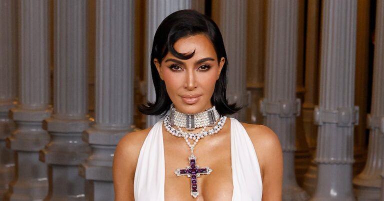 Kim Kardashian Stuns in Naked Dress as She Poses in Sheer Lace