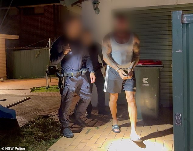 Members of notorious Australian gang are marched out of their homes in handcuffs – as officers make extraordinary discovery inside