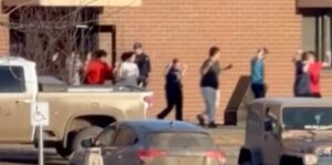 Terrified students seen fleeing Tumbler Ridge school in Canada as nine are killed in horror mass shooting