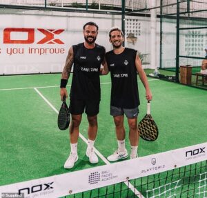 Terrifying moment an Aussie dad cheats death when a 3m-wall of glass explodes on top of him as plays game of padel ball in Bali