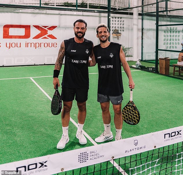 Terrifying moment an Aussie dad cheats death when a 3m-wall of glass explodes on top of him as plays game of padel ball in Bali