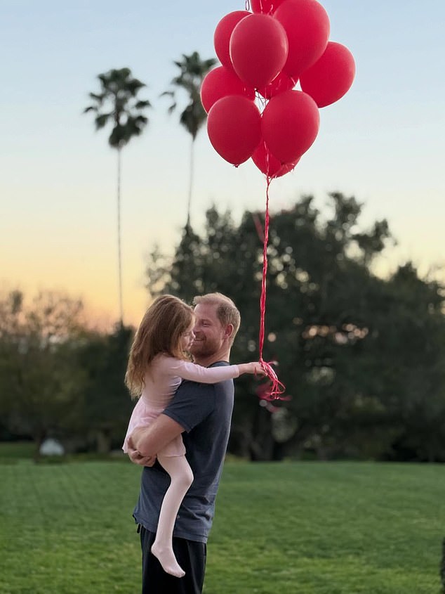 Meghan shares photo of beaming Harry carrying Lilibet in his arms as she gushes they and Archie are her ‘forever Valentines’