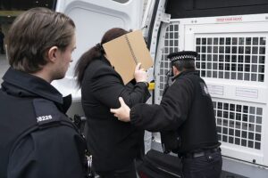Moment trans activist who accused Graham Linehan of harassment – only for the comedian to be cleared – is arrested outside court