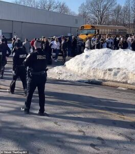 One dead and four rushed to hospital after gunman opens fire at high school hockey game in Rhode Island