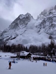 Moment avalanche cascades down mountain in Italy as dozens of skiers watch on – before desperately trying to flee