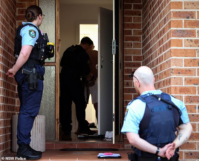 Man is charged with terrorism offences after cops allegedly make disturbing discovery on phone seized during vehicle stop in Yagoona