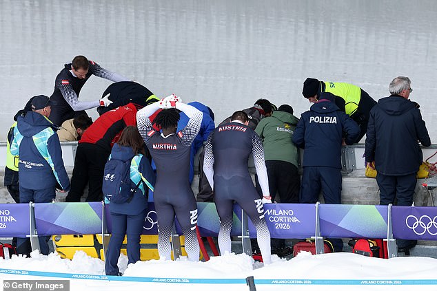 Bobsleigh driver hospitalised at Winter Olympics after terrifying crash during four-man final – with event delayed by over 20 minutes while he received urgent medical attention