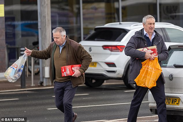 Andrew’s security team stock up on lager and noodles after driving him home from police station following arrest