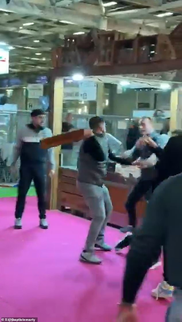 Fromage affray! Moment French farmers use cheeseboards as weapons during brawl with visitors at agriculture show