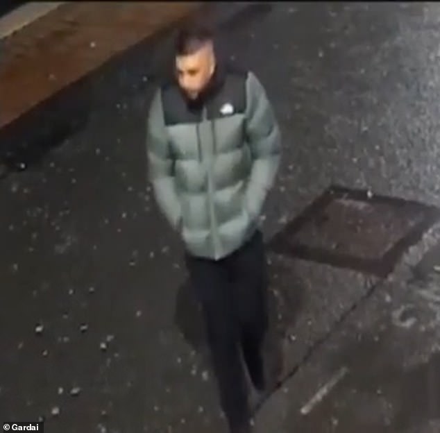 Sickening moment punches random woman on the street and knocks her unconscious: Police hunting thug