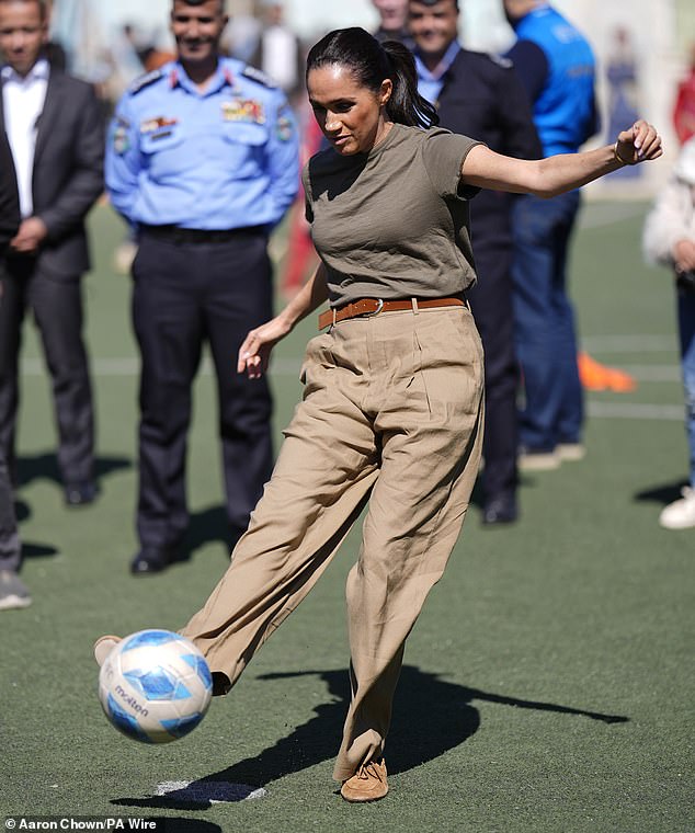 Bend it like Meghan! Duchess celebrates scoring a goal against a child – and proves she’s a match for Kate when it comes to playing the beautiful game