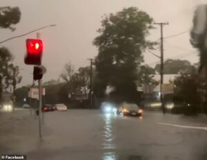 Dangerous flash flooding hits Sydney with commuters trapped in gridlock for hours