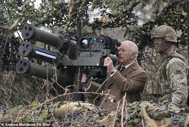 King Charles learns how to shoot down drones as he oversees troops rehearsing defending themselves from air attacks at Army base