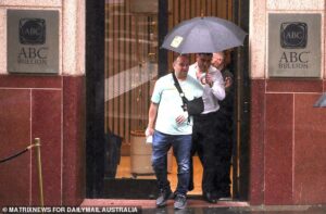 Bondi massacre hero Ahmed al-Ahmed is laughing all the way to the bank as he ploughs his millions into GOLD – and gets a rock star welcome in Sydney’s financial centre