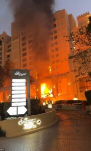 Four people are injured in Iranian Shahed drone strike on five-star hotel in Dubai: Fire breaks out after attack in retaliation for US air strikes