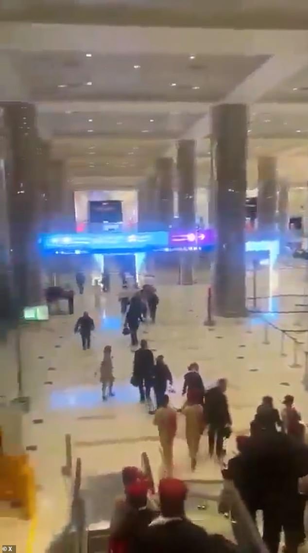 Panic at Dubai Airport as ‘it is hit by an Iranian suicide drone’ and passengers flee wrecked terminal