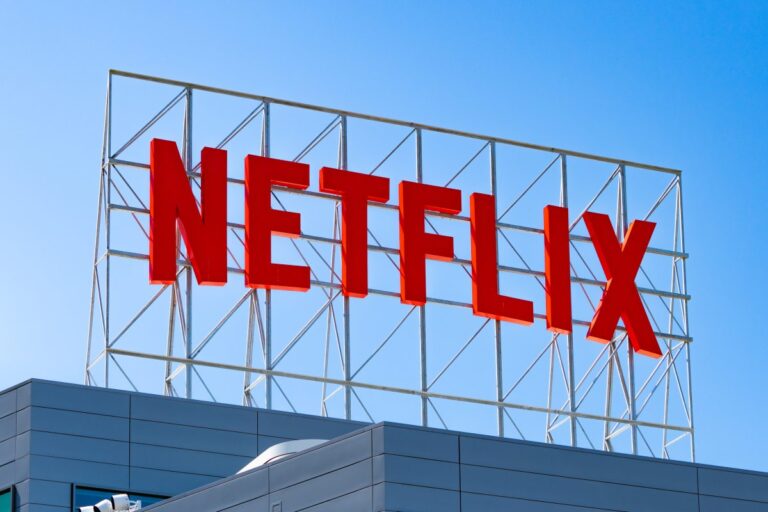Why did Netflix back down from its deal to acquire Warner Bros.?