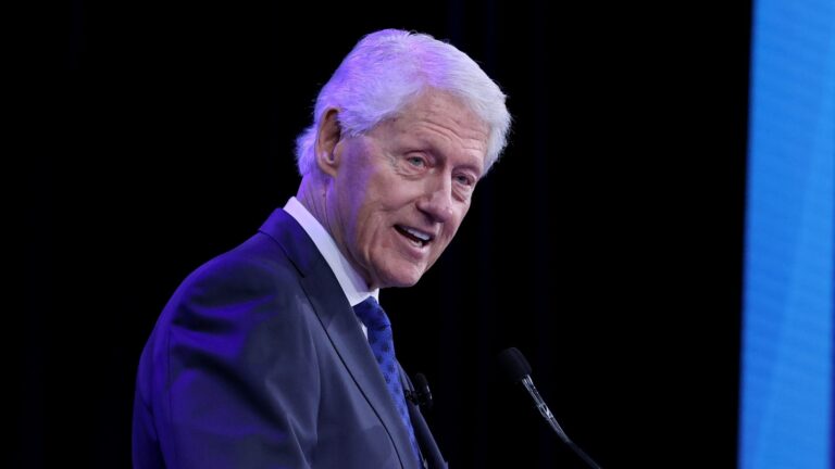 Bill Clinton Grins, Chuckles at Photo During Epstein Testimony
