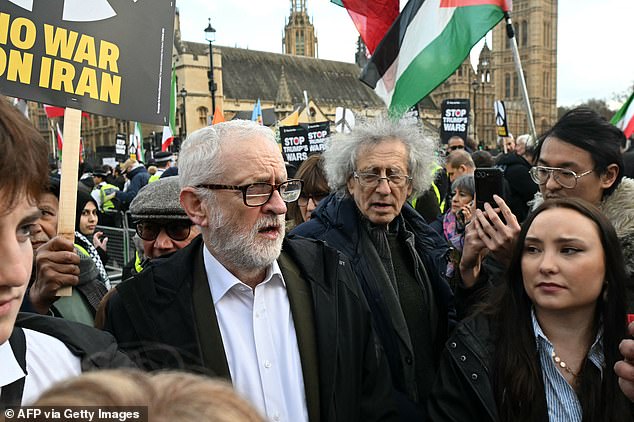 Jeremy Corbyn accuses Donald Trump of launching ‘clearly illegal attack to bring about regime change’ after joining hundreds of pro-Iran protesters in London carrying banners of the Ayatollah