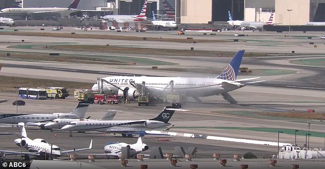 United Boeing 787 makes emergency landing at LAX after terrifying engine failure that saw passengers evacuate using slides