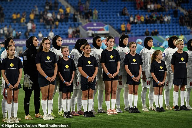 The Iranian football team REFUSE to sing their national anthem at the Asian Cup as war rages in their homeland