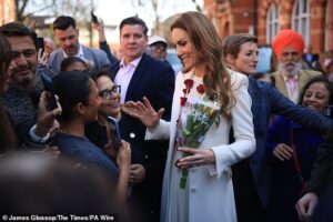 Radiant Princess of Wales stuns as she dons winter white coat and red rose garland on visit to Leicester’s ‘Golden Mile’ the day after Hindu spring festival