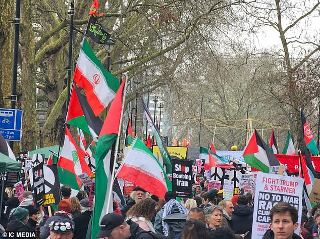Leftist demonstrators chant ‘victory to Iran’ as thousands march on US Embassy in London demanding an end to the bombing