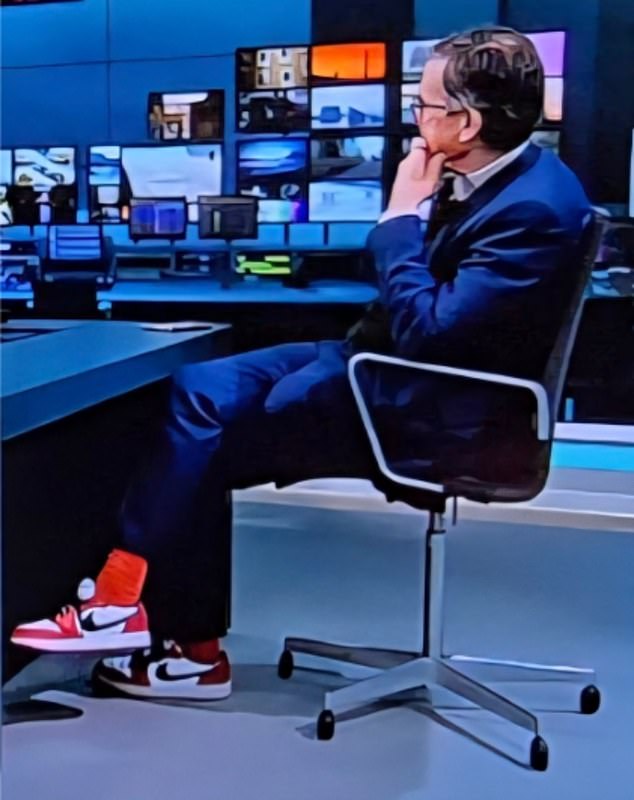 ‘The absolute state of Robert Peston!’ Viewers’ shock at 65-year-old broadcaster’s garish red £145 Nike trainers and ‘knuckle duster’ rings while covering Middle East conflict