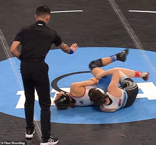 First ever NCAA women’s wrestling tournament marred by wild ‘brutality’ claim… as competitor is accused of biting her OWN arm to get rival DQ’d