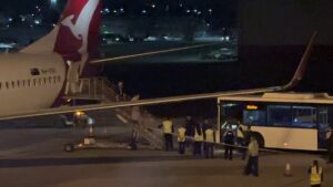 Iranian women’s soccer team flies out of Australia – as claim emerges of players’ families taken hostage in their home country