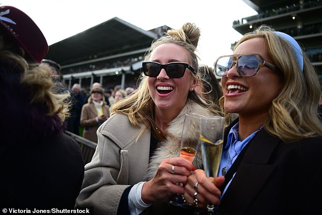And they’re off (their heads!): Cheltenham punters enjoy boozy first day of races as pints flow in drunken start to the festival