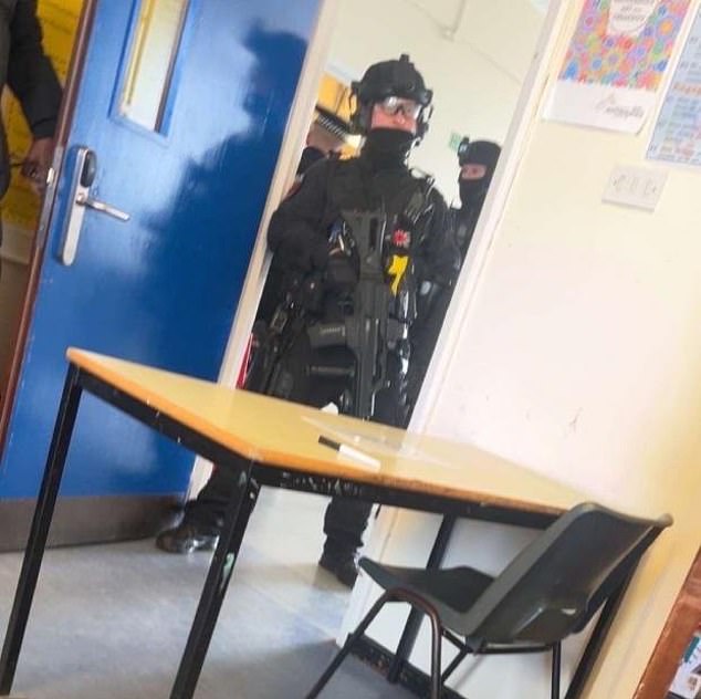 Moment armed police stormed class after teenage girl was stabbed as terrified pupils cowered under desks – before boy, 16, was arrested