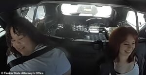 Florida girls aged 14 and 15 cackle in back of police cruiser after they were arrested on suspicion of plotting to kill classmate for blood ritual