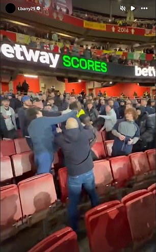 Everton star claims club’s fans ‘ATTACKED’ his friends in Arsenal away end: Shocking footage posted by Thierno Barry shows violent clashes between supporters as police launch investigation