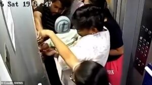 Moment baby gets its arm trapped in elevator door in terrifying incident