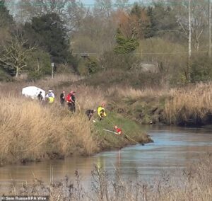 Frantic search for two missing teenagers after car with five youngsters inside plunged into river