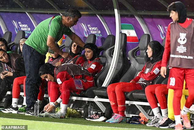 Iranian women’s footballers arrive home to hero’s reception… but a chilling reminder of dangers they face lurks in the background