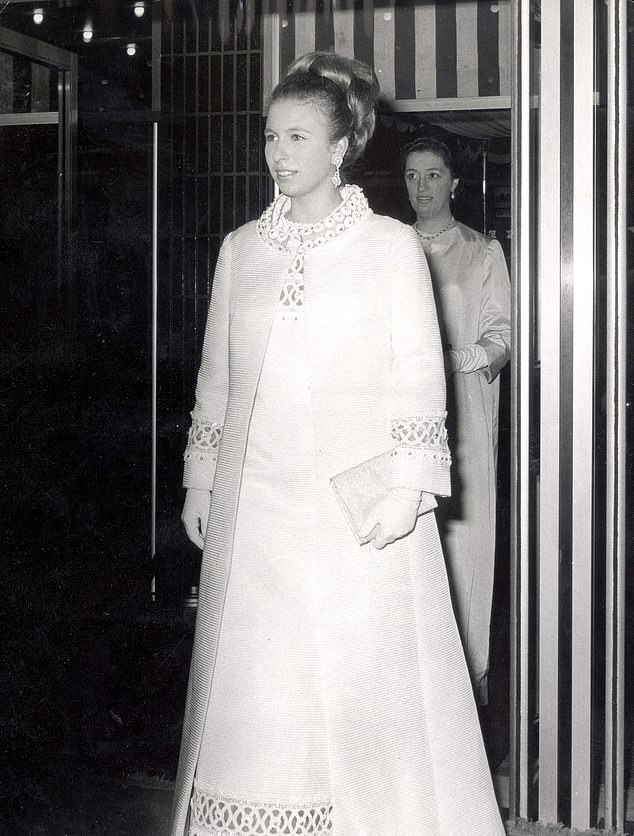 The Queen of Royal recycling! Princess Anne slips into floor-length coat for King’s state banquet… 57 YEARS after she first wore it