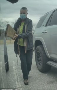 ‘Karen’ called KAREN was caught on camera damaging Tesla Cybertruck with nail-studded board, cops say