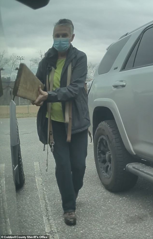 ‘Karen’ called KAREN was caught on camera damaging Tesla Cybertruck with nail-studded board, cops say