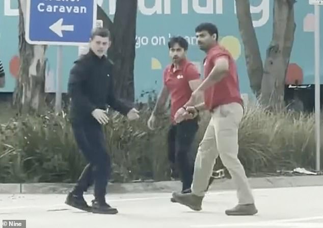 Wild moment delivery driver turns the tables on two alleged armed carjackers who demanded he hand over his keys