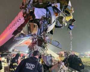 Shocking new LaGuardia theory that could CLEAR air traffic controller of responsibility for deadly plane collision… as nervous travelers are forced to taxi past wreckage