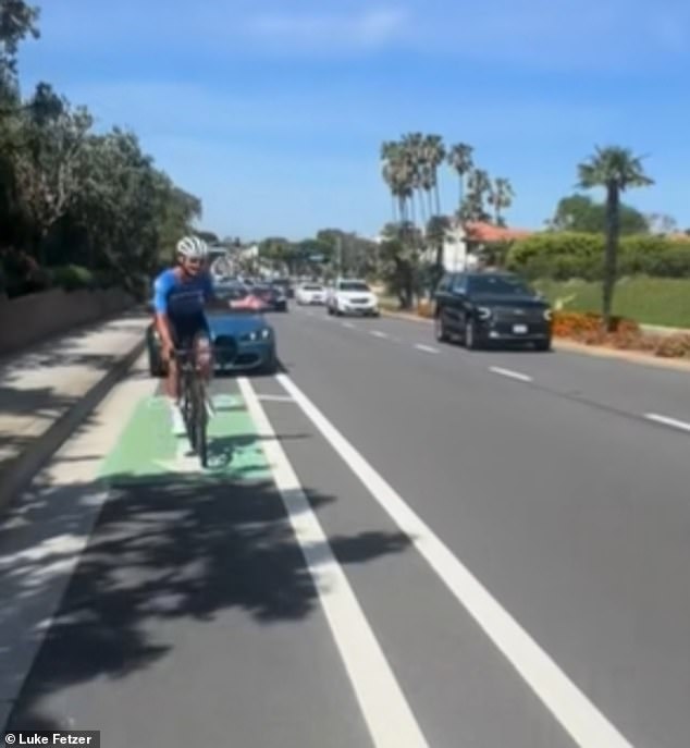 Raging BMW driver swerves into cycle lane and starts hurling objects at bikers in ritzy Newport Beach