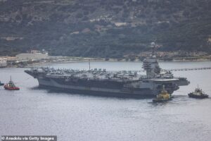America’s new $13bn aircraft carrier forced to retreat from Iran war because eco-friendly toilets won’t flush… as our brave sailors left to sleep on the floor after part of ship caught FIRE