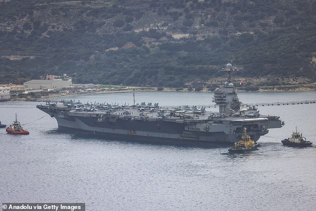 America’s new $13bn aircraft carrier forced to retreat from Iran war because eco-friendly toilets won’t flush… as our brave sailors left to sleep on the floor after part of ship caught FIRE